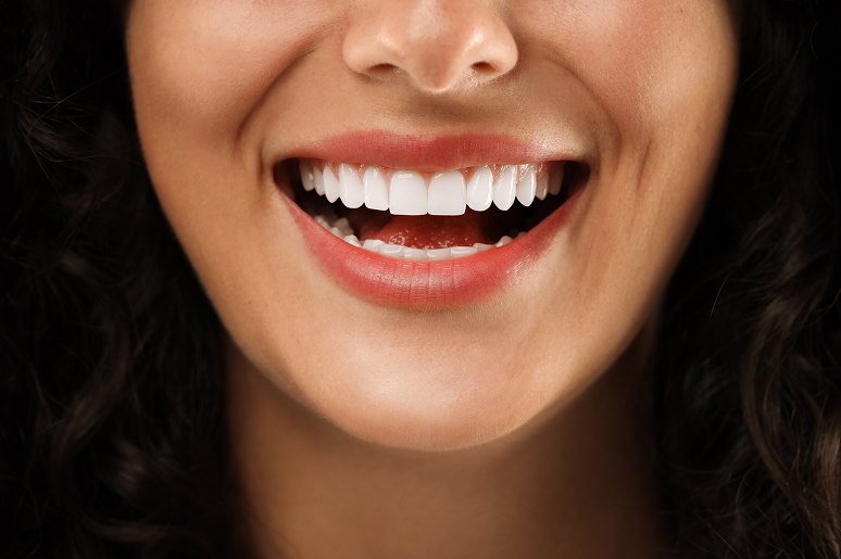 Patient smiling after dental restoration