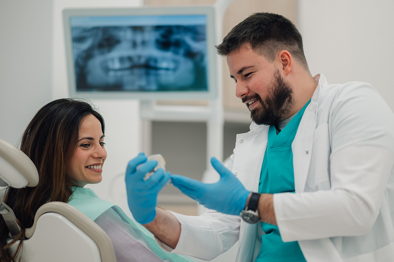 Dr. Caputo reviewing implant candidacy with a patient